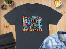 Load image into Gallery viewer, Dark t-shirt with "I'm a Nurse, What's Your Superpower?" text and cartoon superhero nurse graphic.
