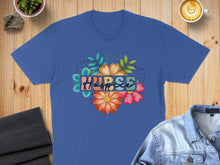 Load image into Gallery viewer, Blue t-shirt with "Nurse" in colorful floral lettering.
