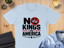 Load image into Gallery viewer, Light blue t-shirt with "NO KINGS IN AMERICA" text and a red circle-slash symbol over a crown.
