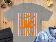 Load image into Gallery viewer, Grey t-shirt with "LUNCH DAY" text and pink stripes.
