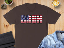 Load image into Gallery viewer, Brown t-shirt with "BRUH" text in American flag pattern.

