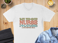 Load image into Gallery viewer, White t-shirt with "NURSE LOVE INSPIRE HEAL" text.
