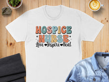Load image into Gallery viewer, White t-shirt with "HOSPICE NURSE Love Inspire Heal" text in colorful retro font.

