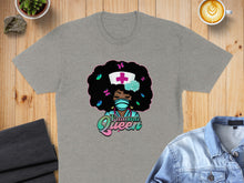 Load image into Gallery viewer, Gray t-shirt with cartoon nurse, Afro hair, butterflies, and text "Trauma Queen".
