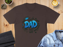 Load image into Gallery viewer, Brown t-shirt with "Dad Hero Protector Man of God Funny Loving Hardworking" text.
