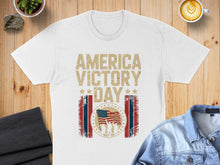 Load image into Gallery viewer, White t-shirt with "America Victory Day May 08" text and American flag graphic.
