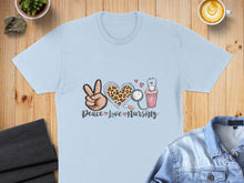 Load image into Gallery viewer, Light blue t-shirt with "Peace Love Nursing" text and heart graphic.
