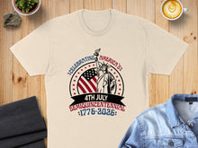Load image into Gallery viewer, Cream t-shirt with "Celebrating America's Semiquincentennial 1776-2026" graphic.
