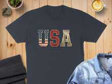 Load image into Gallery viewer, Navy t-shirt with distressed "USA EST. 1776" graphic featuring American flag and cityscape.
