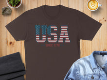 Load image into Gallery viewer, Brown t-shirt with "USA SINCE 1776" in red, white, and blue flag design.

