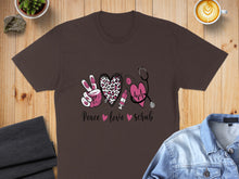 Load image into Gallery viewer, Brown t-shirt with "Peace Love Scrub" text, heart, stethoscope, and leopard print.
