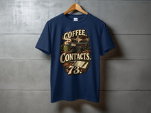 Load image into Gallery viewer, Navy t-shirt with "Coffee Contacts 73" text and graphics of a radio, mug, and logbook.

