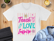 Load image into Gallery viewer, White t-shirt with "Teach Love Inspire" text and floral design.
