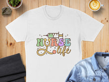 Load image into Gallery viewer, White t-shirt with "Nurse Life" text and a syringe graphic.

