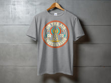 Load image into Gallery viewer, Grey t-shirt with a vintage "On The Air CQ 73 Amateur Radio" graphic.
