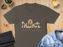 Load image into Gallery viewer, Brown t-shirt with "Nurse A Title Just Above Queen" text and floral nurse cap graphic.
