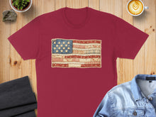 Load image into Gallery viewer, Maroon t-shirt with distressed American flag graphic made of fabric textures.
