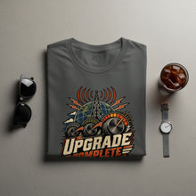 Load image into Gallery viewer, T-shirt with globe, antenna, dials, and "UPGRADE COMPLETE" text.
