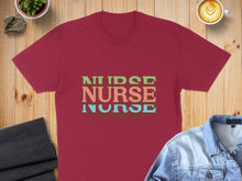 Load image into Gallery viewer, Burgundy t-shirt with "Nurse Love Inspire Heal" text in colorful block letters.
