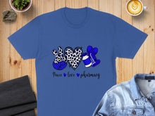 Load image into Gallery viewer, Blue t-shirt with "Peace love pharmacy" text and leopard print heart.
