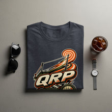 Load image into Gallery viewer, Dark grey t-shirt with a colorful "QRP" graphic featuring a bullseye and racing elements.
