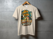 Load image into Gallery viewer, Shirt graphic with a sun character, meter, and text "Solar Flux Controls My Weekend."
