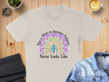 Load image into Gallery viewer, Cream t-shirt with colorful rainbow and stethoscope design and text.
