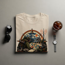 Load image into Gallery viewer, T-shirt with illustration of hiker planning route with map, compass, and radio equipment.
