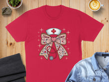 Load image into Gallery viewer, Red t-shirt with pink bow, stethoscope, and "XOXO" text.
