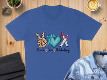 Load image into Gallery viewer, Blue t-shirt with "Peace, Love, Phlebotomy" design featuring syringes and a heart.

