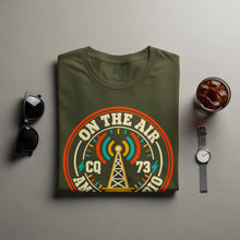 Load image into Gallery viewer, Green t-shirt with "On the Air CQ 73" and radio tower graphic.
