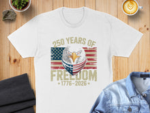 Load image into Gallery viewer, White t-shirt with eagle wearing bandana, American flag, and text "250 YEARS OF FREEDOM 1776-2026".
