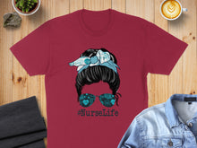 Load image into Gallery viewer, Burgundy t-shirt with messy bun and "#NurseLife" sunglasses graphic.
