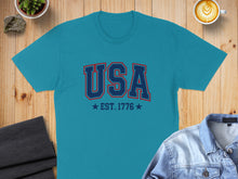 Load image into Gallery viewer, Teal t-shirt with "USA EST. 1776" text in red and blue.
