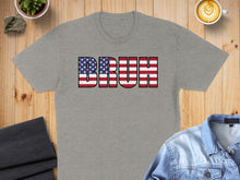 Load image into Gallery viewer, Grey t-shirt with "BRUH" in American flag pattern.
