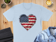 Load image into Gallery viewer, Light blue t-shirt with a distressed American flag heart graphic.
