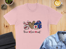 Load image into Gallery viewer, Pink t-shirt with "Peace love emt" and medical icons.
