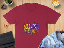 Load image into Gallery viewer, Maroon t-shirt with "NURSE" in colorful, spooky Halloween-themed letters and graphics.
