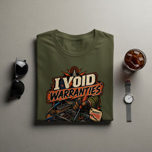 Load image into Gallery viewer, Olive green t-shirt with "I VOID WARRANTIES" graphic of electronics repair.
