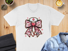 Load image into Gallery viewer, Pink stethoscope and nurse's hat with XOXO pattern on a white t-shirt.
