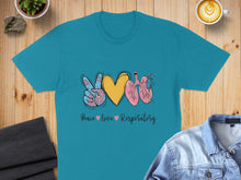 Load image into Gallery viewer, Teal t-shirt with peace sign, heart, and lungs design.
