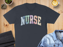 Load image into Gallery viewer, Dark t-shirt with "NURSE" in colorful patchwork lettering.
