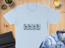 Load image into Gallery viewer, Light blue t-shirt with "Te Ac H Er" periodic table elements and "the inspirational element".
