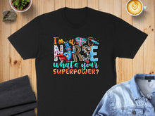 Load image into Gallery viewer, Nurse with superhero hat and stethoscope saying "I'm a nurse, what's your superpower?".
