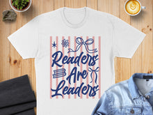 Load image into Gallery viewer, White t-shirt with "Readers Are Leaders" text and bow graphic.
