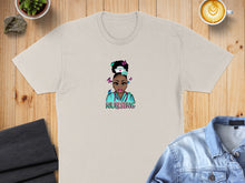 Load image into Gallery viewer, Cream t-shirt with cartoon nurse graphic and the word "NURSING".
