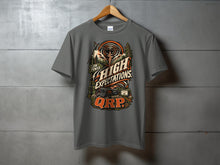 Load image into Gallery viewer, T-shirt graphic with "Low Power High Expectations QRP" text and radio equipment.
