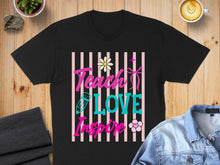 Load image into Gallery viewer, Black t-shirt with "Teach Love Inspire" text and floral accents.
