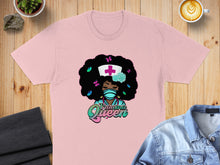 Load image into Gallery viewer, Pink t-shirt with a graphic of a nurse with colorful afro and "Trauma Queen" text.
