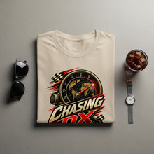 Load image into Gallery viewer, Light cream t-shirt with "Chasing DX" graphic featuring a speedometer and globe.
